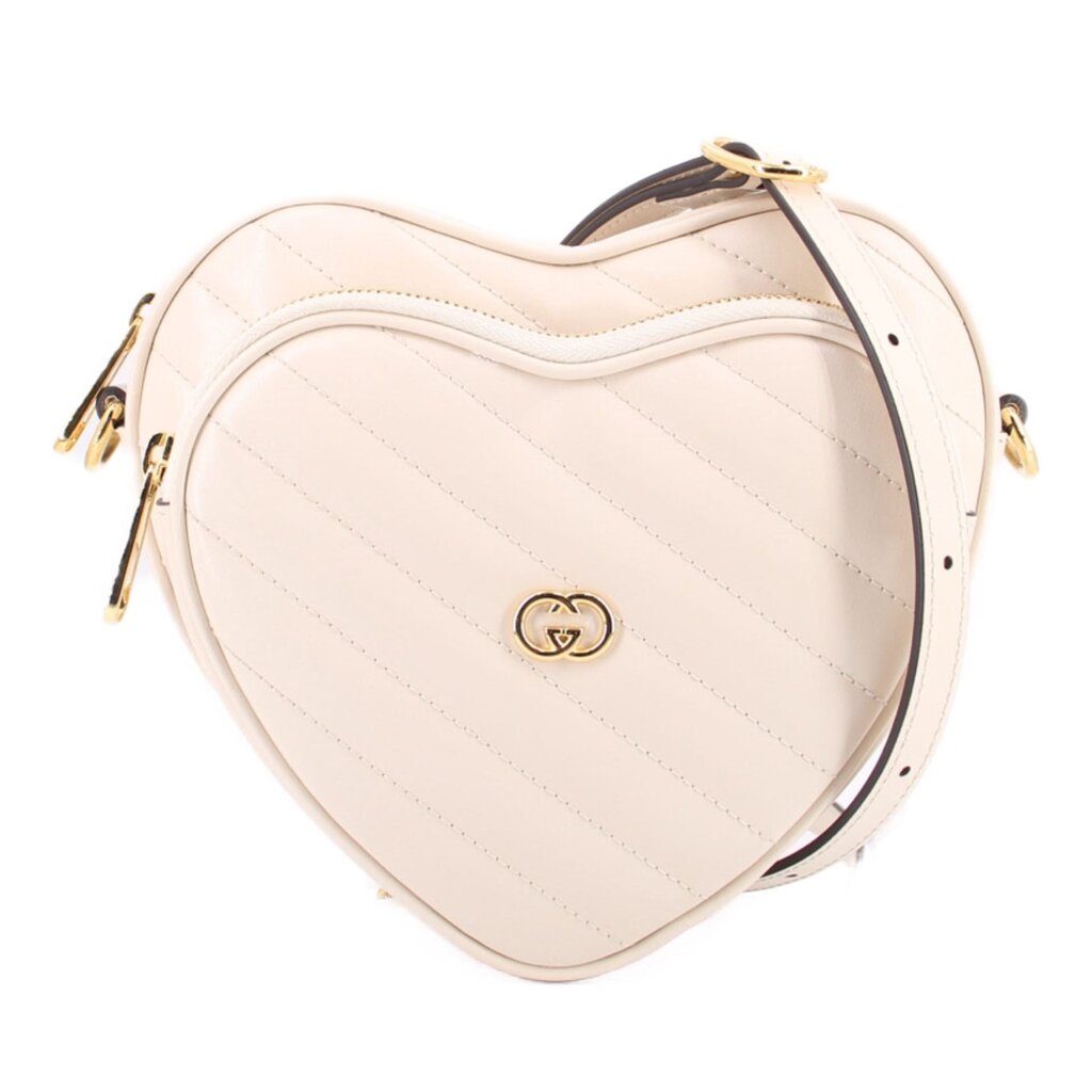GUCCI cream heart crossbody bag with GG heart logo and gold hardware
