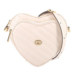 GUCCI cream heart crossbody bag with GG heart logo and gold hardware