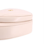 GUCCI cream heart crossbody bag close-up of front zipper track and stitching