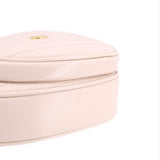 GUCCI cream heart crossbody bag close-up of front zipper track and stitching