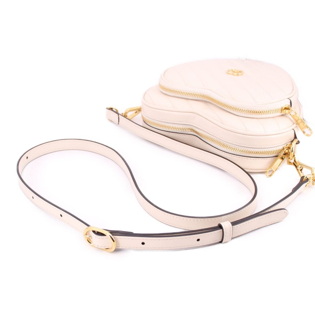 GUCCI cream heart crossbody bag with adjustable strap and zip closure pouch