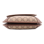 Brown GG monogram crossbody bag side profile with flap edge and leather lining