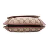 Brown GG monogram crossbody bag side profile with flap edge and leather lining