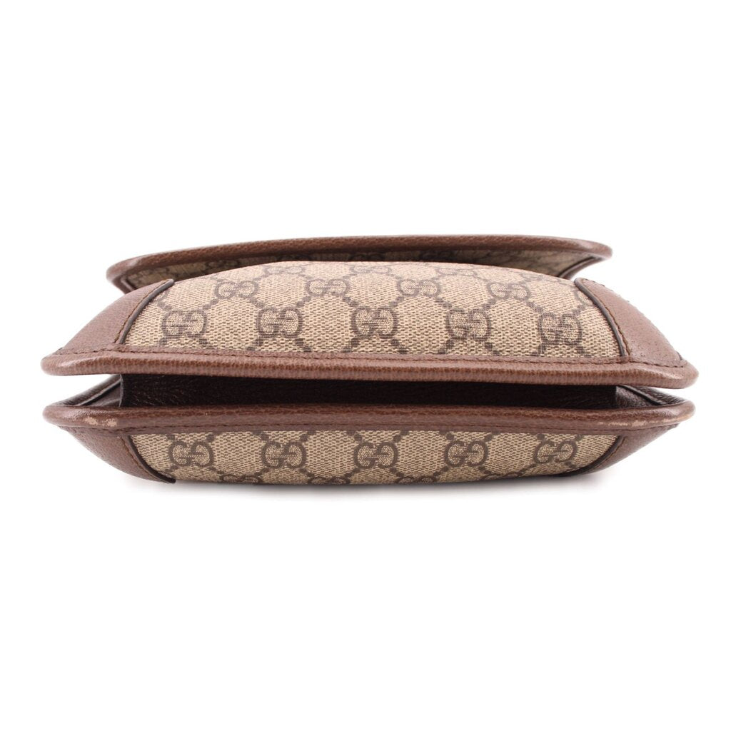 GUCCI GG canvas crossbody bag top view with flap and brown leather edges