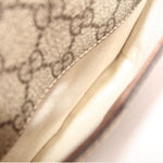 GUCCI GG canvas crossbody bag fabric close-up with brown leather trim