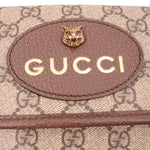 Gucci crossbody front patch with lion head emblem and Gucci lettering on leather