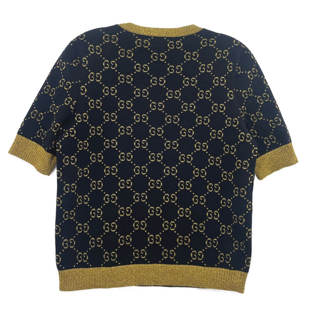 Navy Gucci logo sweater with gold GG pattern, short sleeves and ribbed hem.