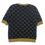 Navy Gucci logo sweater with gold GG pattern, short sleeves and ribbed hem.