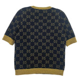 Navy Gucci logo sweater with gold GG pattern, short sleeves and ribbed hem.