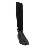 Knee-high riding boots in black with smooth upper and low stacked heel