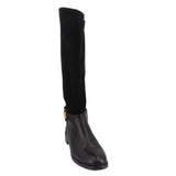 Knee-high riding boots in black with smooth upper and low stacked heel
