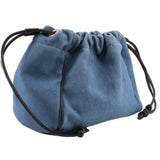 Denim blue drawstring pouch with gathered top, black cords, and metal eyelet