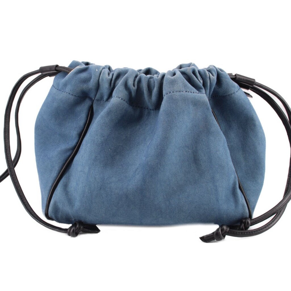 Denim blue drawstring pouch with gathered top and black cord ties