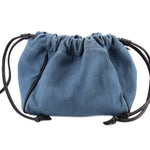 Denim blue drawstring pouch with gathered top and black cord ties