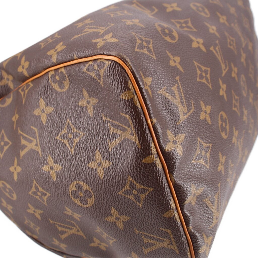 LOUIS VUITTON Speedy 30 vintage handle bag close-up of monogram canvas side with tan edge trim