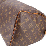 LOUIS VUITTON Speedy 30 vintage handle bag corner close-up with tan piping and monogram