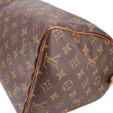 LOUIS VUITTON Speedy 30 vintage handle bag corner close-up with tan piping and monogram