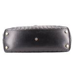 Black quilted shoulder bag base, showing gold studs and stitched panel