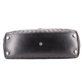 Black quilted shoulder bag base, showing gold studs and stitched panel