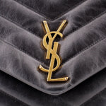 Gold-tone YSL logo on black quilted leather flap of shoulder bag