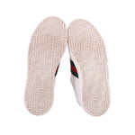 GUCCI Ace sneaker soles with patterned tread and green/red side stripe edge