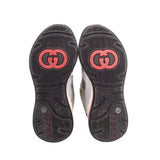 GUCCI Ultrapace sneaker outsoles, dark rubber with red GUCCI logo, textured tread