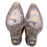 Bottom view of gold cowboy boots with treaded soles and OLDGRINGO logo