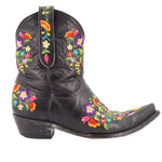 Black women’s cowboy boot with floral embroidery on shaft and instep, low heel.