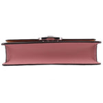 Rose small flap crossbody bag bottom view with wide base and metal clasp top