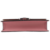Rose small flap crossbody bag bottom view with wide base and metal clasp top
