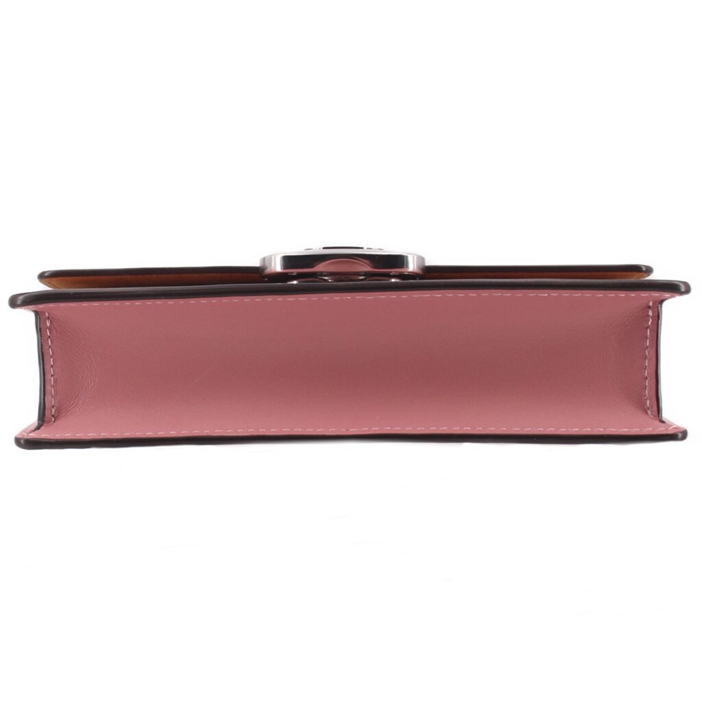 Rose leather crossbody bag side view with slim top profile and metal clasp hardware