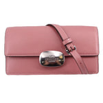 COACH Eliza small flap crossbody in rose pink leather with turn-lock clasp and shoulder strap