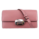 COACH Eliza small flap crossbody in rose pink leather with turn-lock clasp and shoulder strap