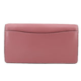 Rose small flap crossbody bag back view with stitched border and flap