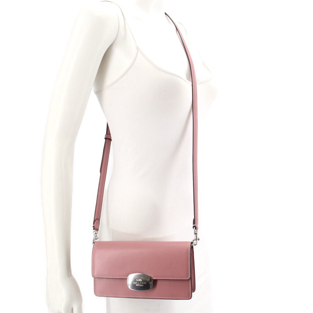 Rose small flap crossbody bag worn on model with adjustable shoulder strap