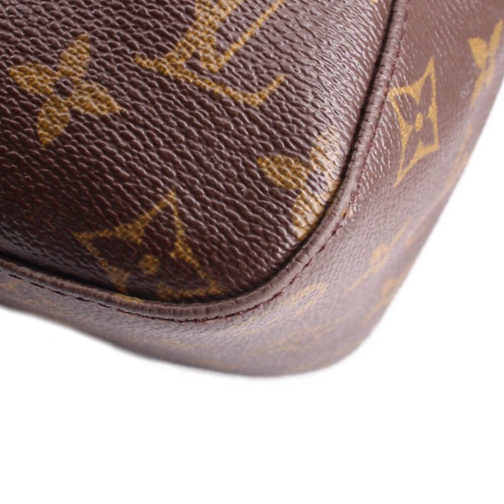 Louis Vuitton monogram shoulder bag corner close-up with leather trim and stitching