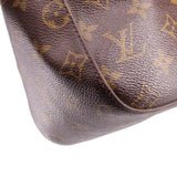 Louis Vuitton monogram shoulder bag side panel close-up with textured leather surface