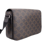 Brown patterned crossbody bag side view with metal ring strap attachment