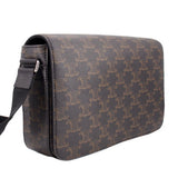 Brown patterned crossbody bag side view with metal ring strap attachment
