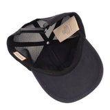 Black trucker cap with mesh back and fabric adjustable strap