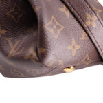 Louis Vuitton Pallas MM monogram satchel detail with stitched edge and metal stud