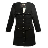 Black long-sleeve dress with button front, flap pockets, and structured waist panels