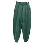 Green knit jogger pants with elastic waist and side pockets
