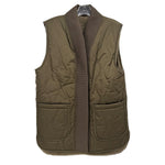 Reversible quilted vest in olive green with ribbed V-neck and side pockets