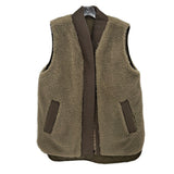 Reversible sherpa vest in tan with front pockets and snap front