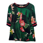Green floral print knit top with crew neck and striped cuffs and hem