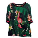 Green floral print knit top with crew neck and striped cuffs and hem
