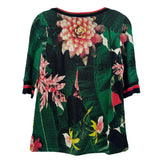 Green floral print knit top with crew neck and striped sleeve cuffs
