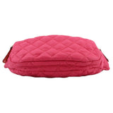 Pink quilted sling belt bag with rounded back panel and zipper ends