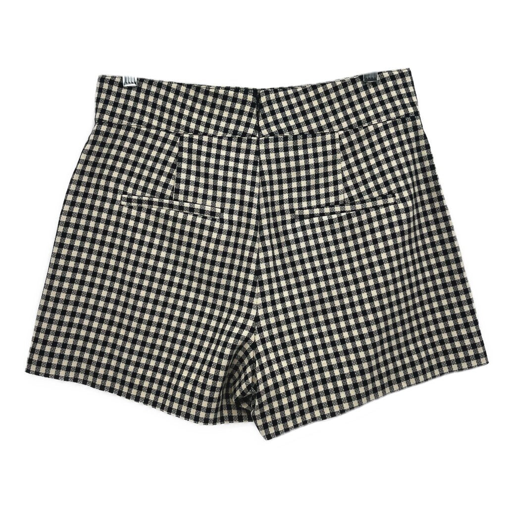 Black-and-white check tailored shorts with belt loops and pleated front